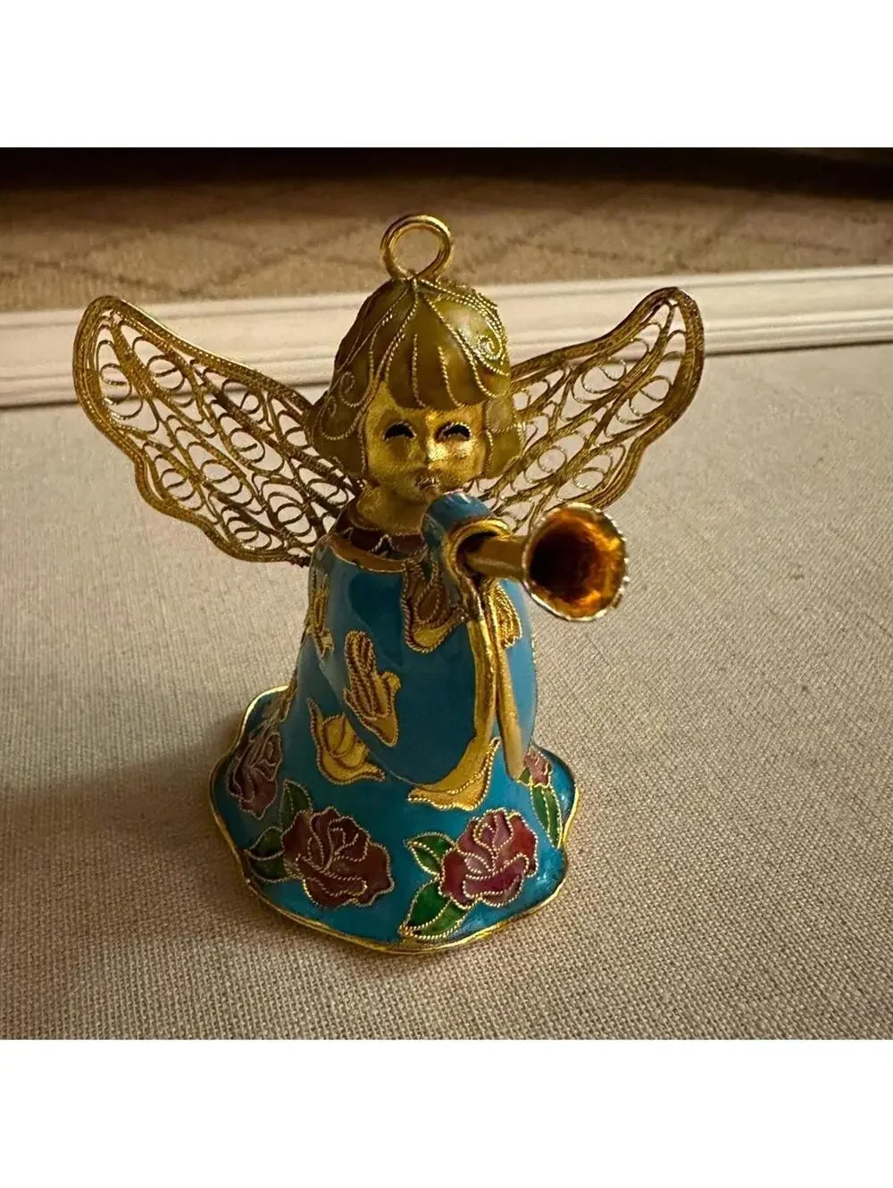 Vintage hand painted and glazed ceramic angel with trumpet 3d details
